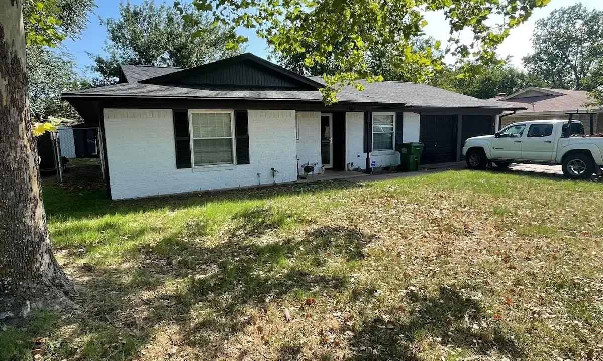 Professional roofing crew working on a residential roof in Tukwila